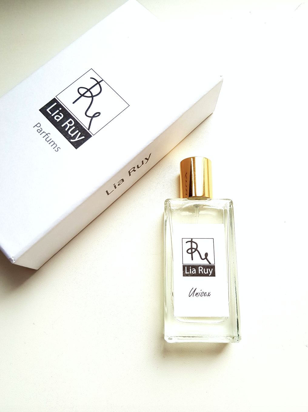 تصویر عطر یونیسکس لیا روی
